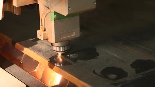 The process of cutting parts from a sheet of metal using a CNC machine