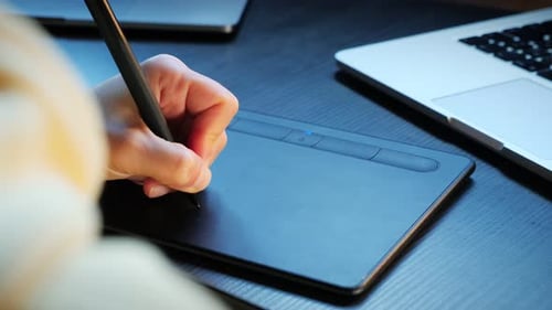 Designer working with interactive pen display.