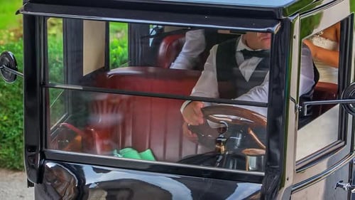 Chauffeur Reversing Vintage Bridal Car. Follow Shot