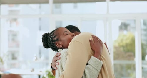 Loving Couple Embracing Indoors in Bright Light