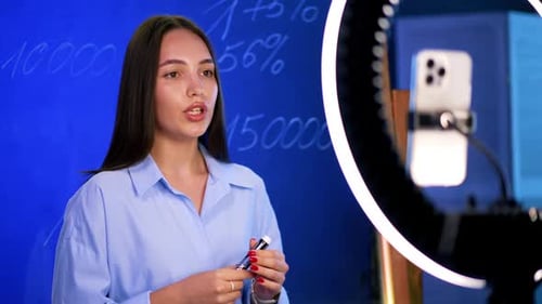 Female Presenter Teaching with Ring Light and Smartphone