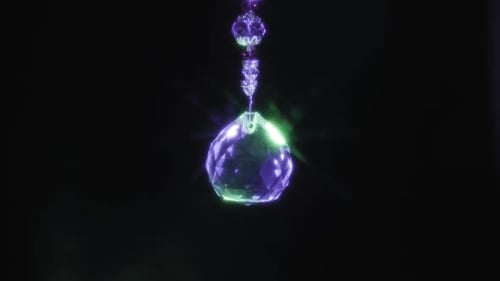 Glowing Crystal Ornament Shimmers Against Black Background