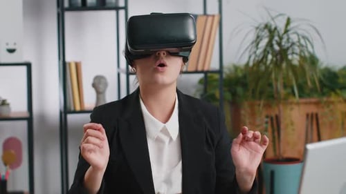 Enthusiastic Woman Using Virtual Reality Headset in Office
