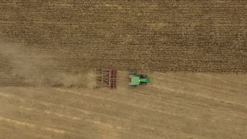 Aerial View of Tractor Plowing Field