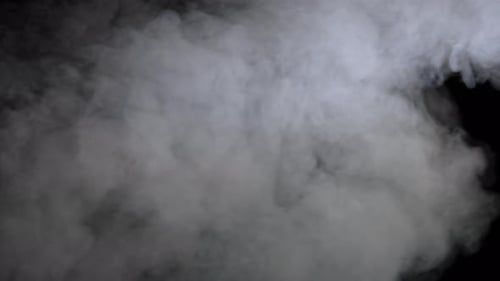 Gray Smoke Billowing on Black Background