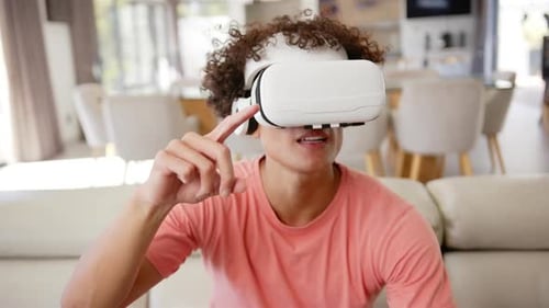 Young Adult Using Virtual Reality Headset at Home