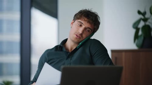 Adult working at a desk in a city office