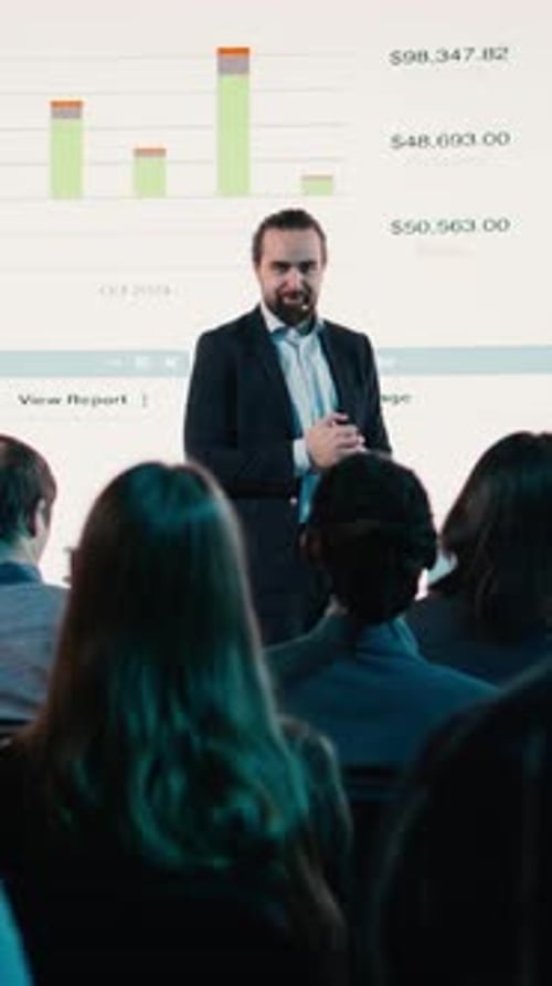 Engaging Presentation by Man in Suit to Audience