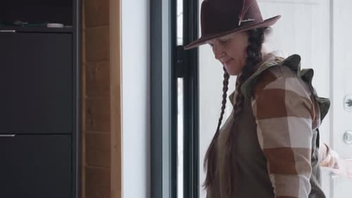 Homemaker Walking Into Room Shutting Door Behind