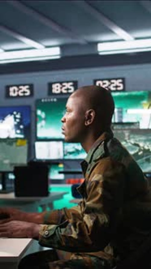 Vertical Video Intelligence Operative in Military Base Doing Surveillance with Radar