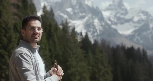 Caucasian Guy On A Sunny Day With Dolomite Mountain Ridge In The Background In Italy. Handheld Shot