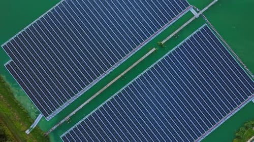 Cinematic Drone Lift Over Floating Solar Panels in Northern European Reservoir