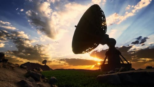 Rotating Satellite Dish Observing Sunset Sky