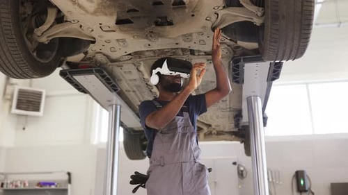 Mechanic Performs Virtual Car Inspection with Advanced Technology