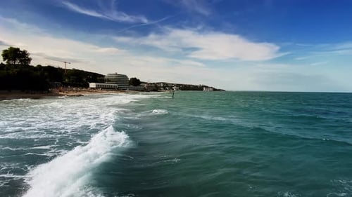 blue waves and Statue of Neptune