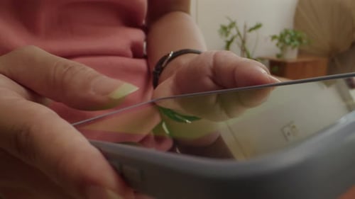 Person Using Tablet Device Indoors Close Up