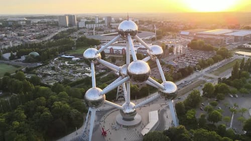 Aerial view of Atomium in Bruxelles at sunset. In the background you can see surrounding buildings a
