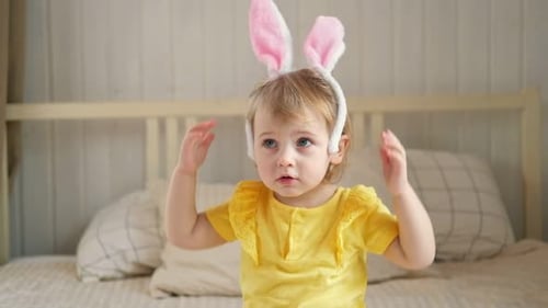 Portrait of Adorable Baby Girl with Bunny Ears