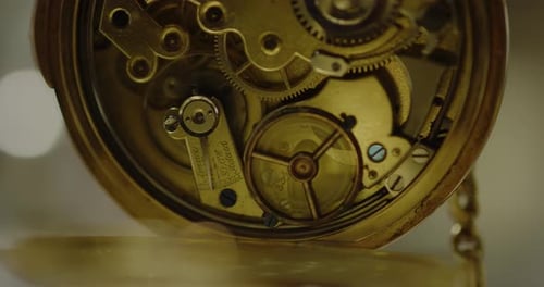 Intricate Gears of a Gold Watch Mechanism