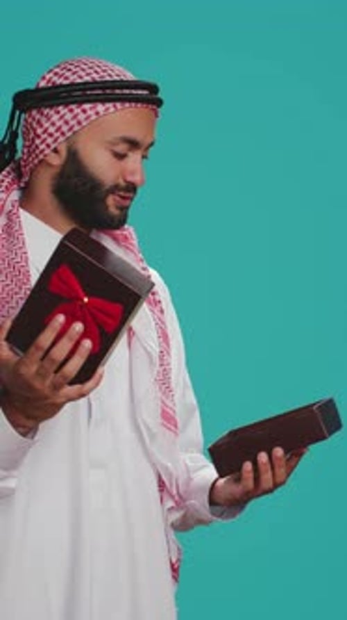 Vertical Video Muslim Adult Opening Giftbox with Bow