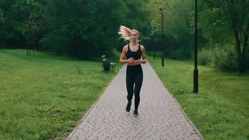 Training of a Young Female Runner in the Park