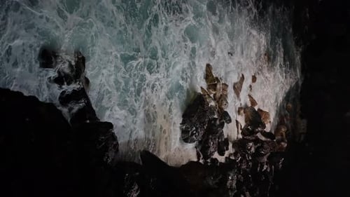 Ocean Surrounded By Rocky Marine Landforms Unique Natural Landscape in the Dark