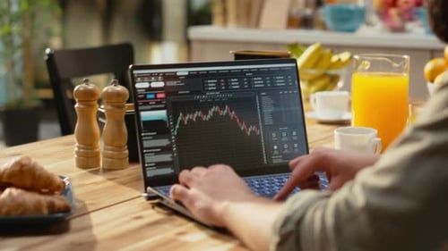 Stockbroker at Home Day Trading Fluctuations Monitoring Market Trends