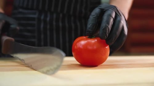 Tomato Cut in Half on Butcher Block