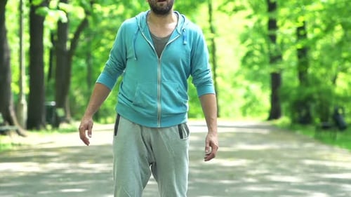 Man, Jogger Stretching In The City Park, Super Slow Motion