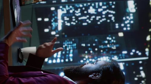 Man Gesturing in front of Futuristic Background