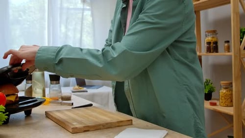 Preparing a Grilled Burger at Home in Kitchen