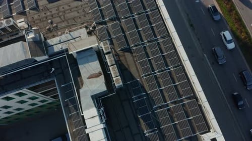 Aerial View of Solar Panels Installed on the Roof of a Large Apartment Building