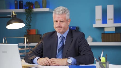 Adult Man Looking Tired in an Office