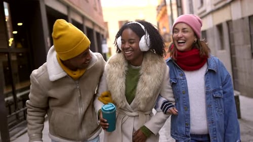 Happy Friends Walking and Smiling in Winter City