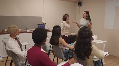 Instructor Giving Presentation to Students in Classroom Setting