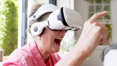 Senior Woman Exploring Virtual Reality with VR Headset