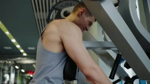 Young Male Athlete Training Hard in Modern Gym Setting