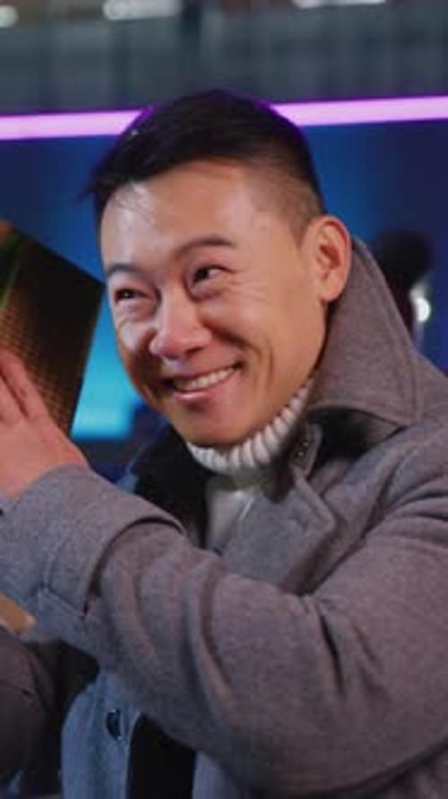 Man Smiling Receiving Christmas Gift Indoors