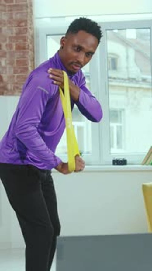 Fitness Training with Resistance Bands in a Bright Indoor Setting for Best Results