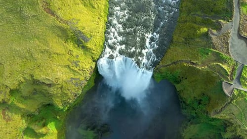 Slow motion aerial view of Skogafoss waterfall, Iceland