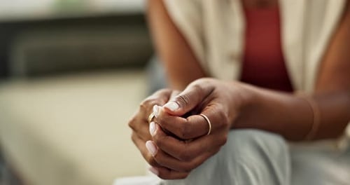 Woman Wringing Hands Showing Rings and Bracelet