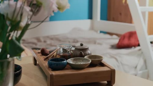 Close-up of Set for Tea Ceremony on Decorative Tray on Wooden Table in Dorm