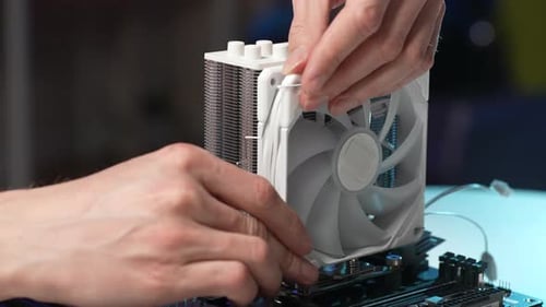 Closeup Hands of Unrecognizable Professional Technician Male Plugs New Cooler Into PC CPU Air