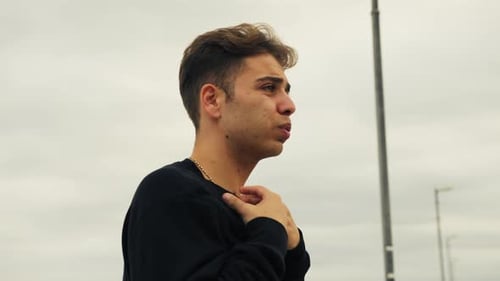 Young Man Anxious and Contemplative in the City