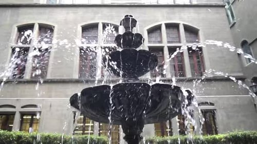 water fountain decorates the gardens of a palace