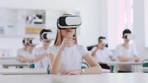 Teens Use VR Headsets in Bright Classroom Setting