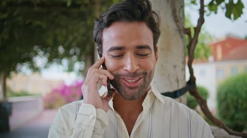 Cheerful Brunette Talking Smartphone at Alley Closeup Happy Man Calling Phone