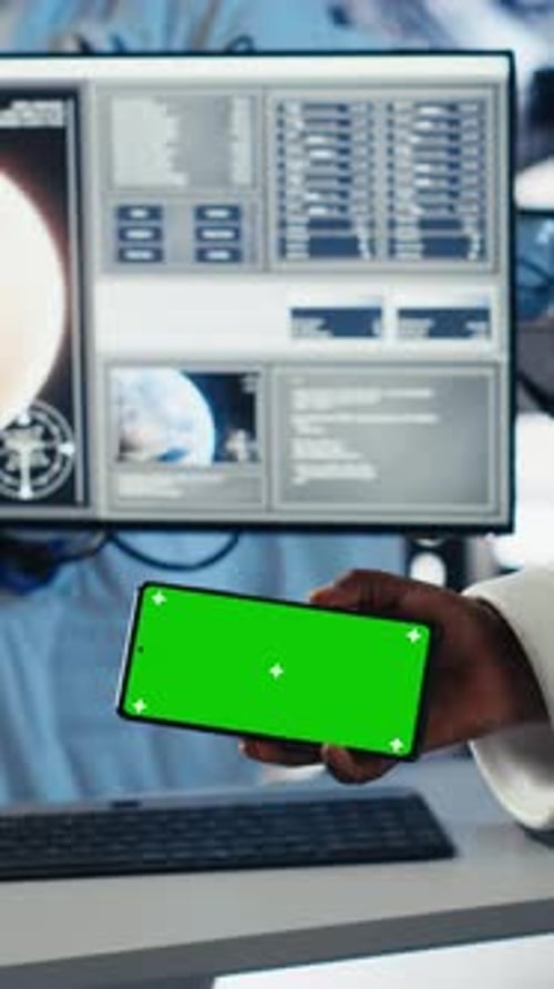 Vertical Video Astronaut Reviewing Onboard Analytics on Laptop Before Stepping Out of Station