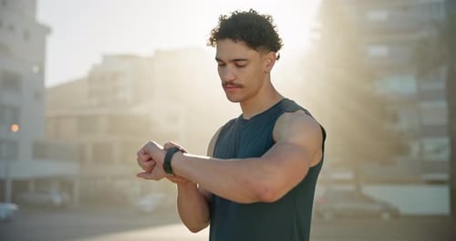 Man, fitness and checking with watch in city for performance, tracking steps or calories
