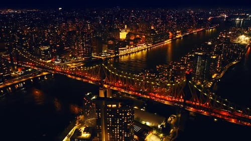 View of amazingly illuminated Queensboro Bridge with lively traffic at night.